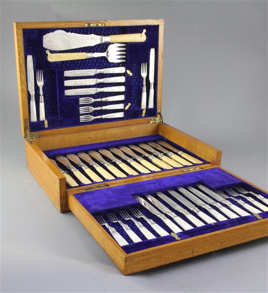 A George V silver service in oak fitted case,